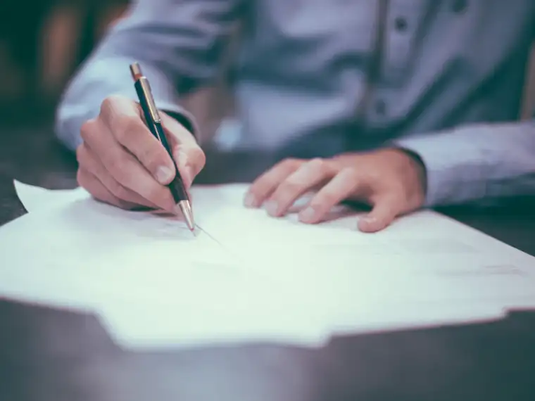 Buyer signing land documents